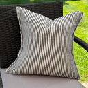 Charcoal striped linen cushion cover with a frayed edge