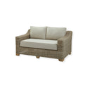Wicker two seater outdoor sofa with cream plush cushions