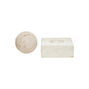 A square-shaped sculpture made of travertine limestone with a fibrous texture, displayed on a white square base.