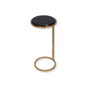 Small round side table with black marble top and aged gold metal frame. 