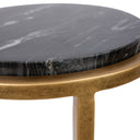 Small round side table with black marble top and aged gold metal frame. 