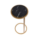Small round side table with black marble top and aged gold metal frame. 