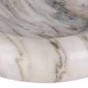 Close-up of a polished white marble surface with soft beige and gray veining.