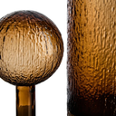 Translucent brown glass decorative bottle with an artisanal textured finish.