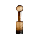 Elegant textured brown glass bottle styled as a statement home decor accent.