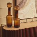 Contemporary brown glass decor accent with a tactile textured finish