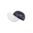 Decorative Marble Sculpture features two contrasting semispheres—one black and one white