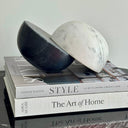 Decorative Marble Sculpture features two contrasting semispheres—one black and one white