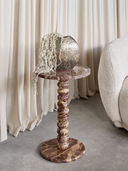 Luxury red marble side table featuring a rounded bobbin base and natural stone variations.