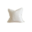 A white linen cushion cover with a zipper closure.